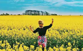 lady in field of flowers